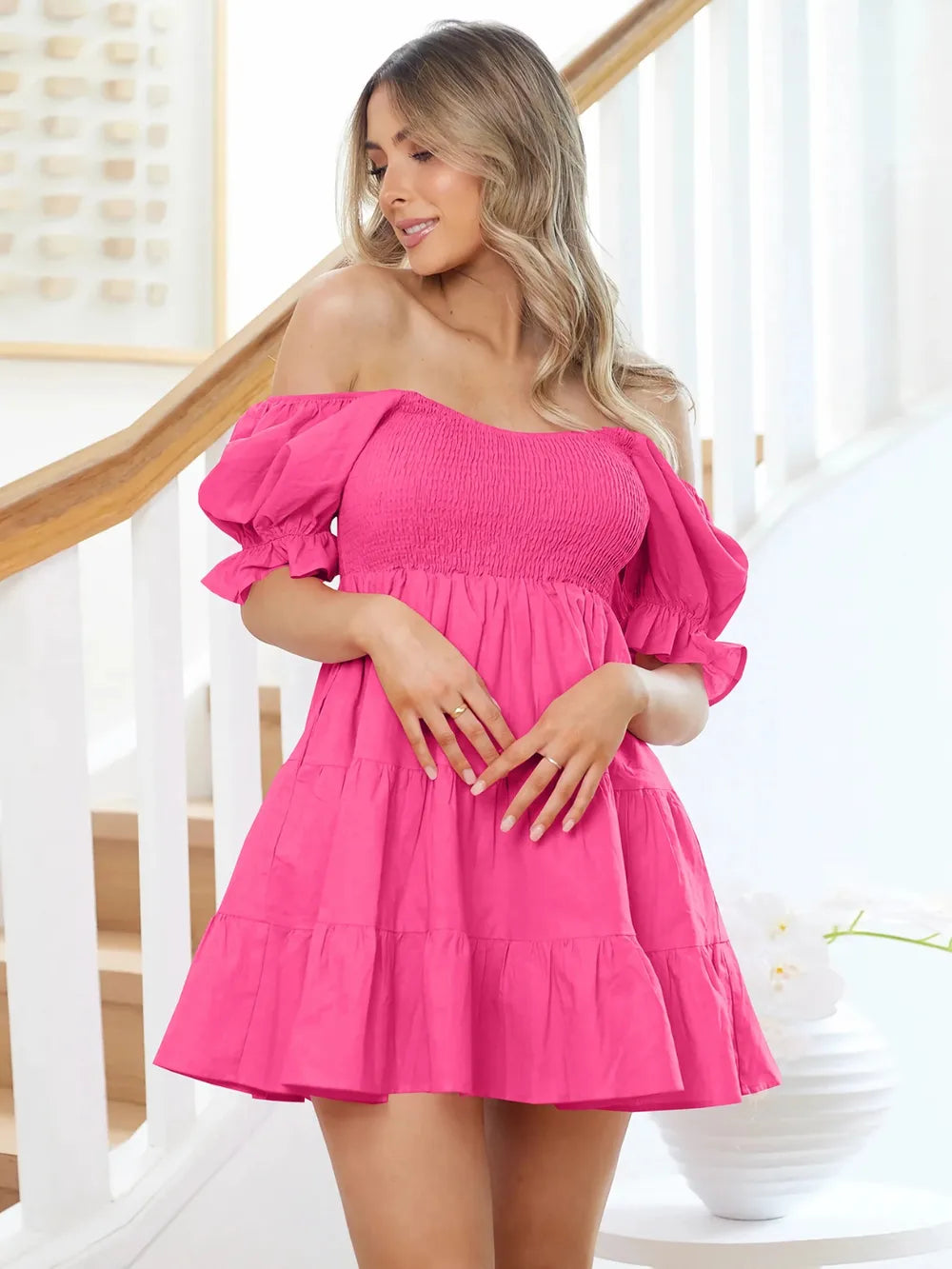 Hot pink smocked tiered mini dress with puff sleeves and flounce cuffs