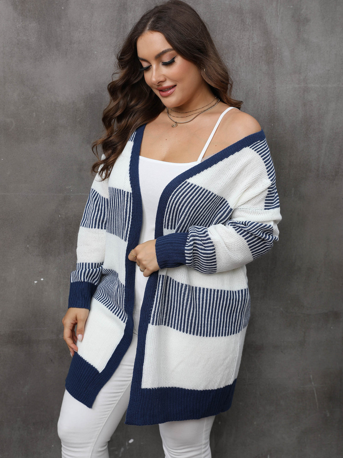 Plus-size striped knit cardigan sweater coat, side view, white and navy blue blocks