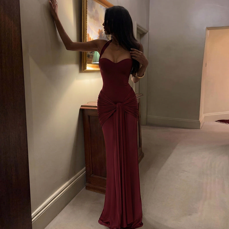 Wine red halter neck maxi dress with draped front and tied waist detail