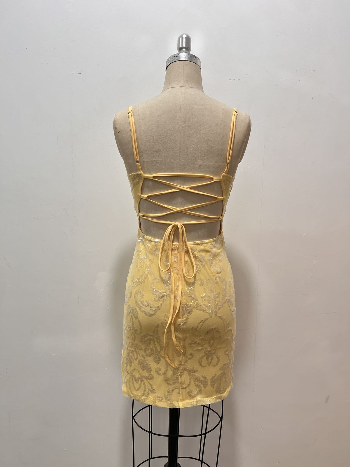 Yellow sequin mini dress with lace-up crisscross open back