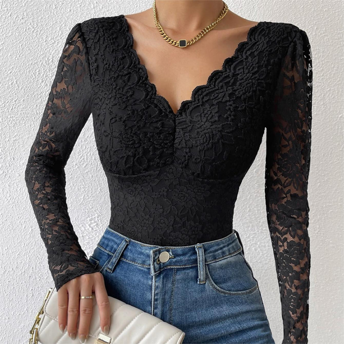 Black lace long-sleeve bodysuit with scalloped V-neck and floral textured lace