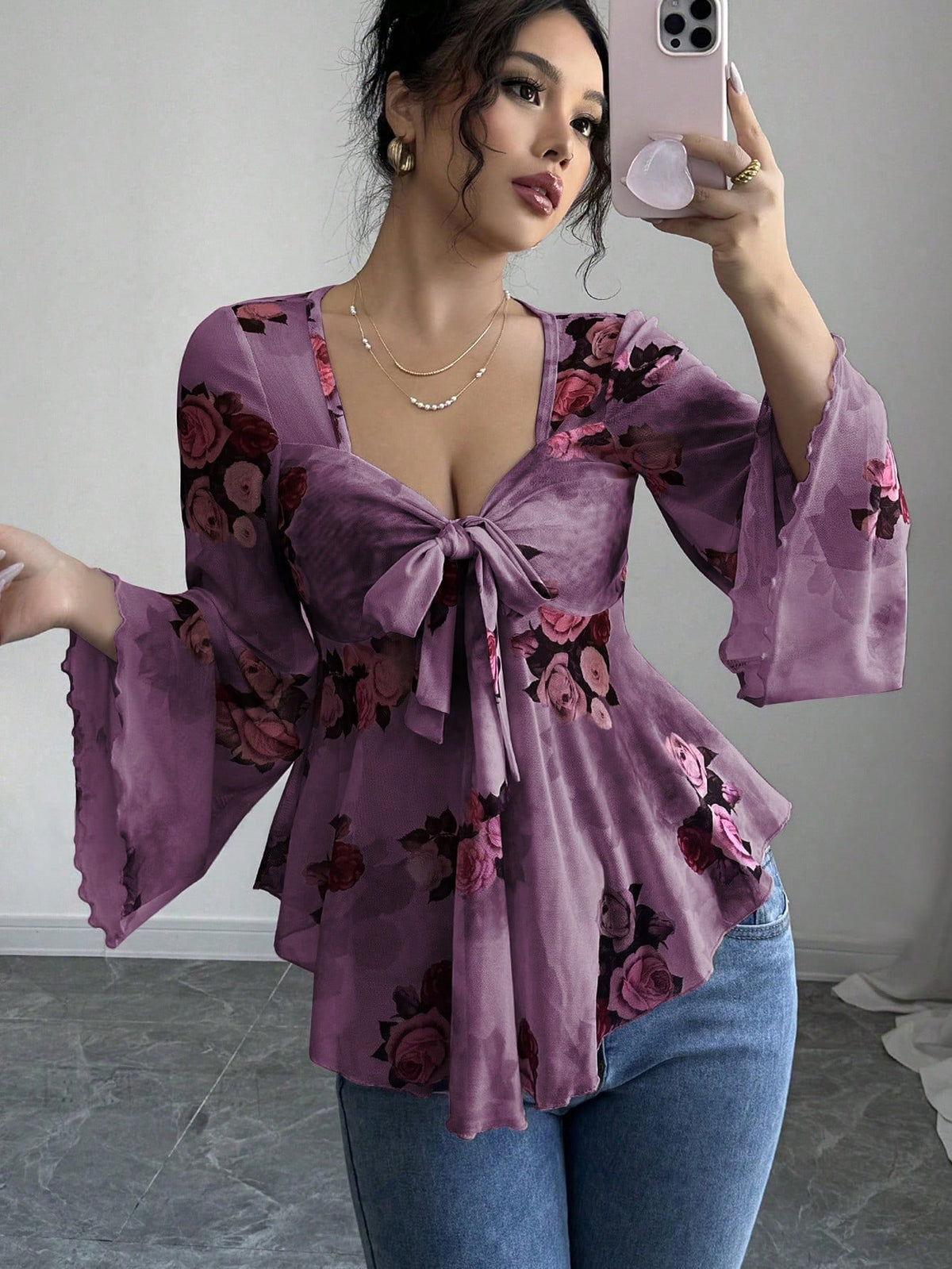 Light purple floral bow-front blouse with long flared bell sleeves