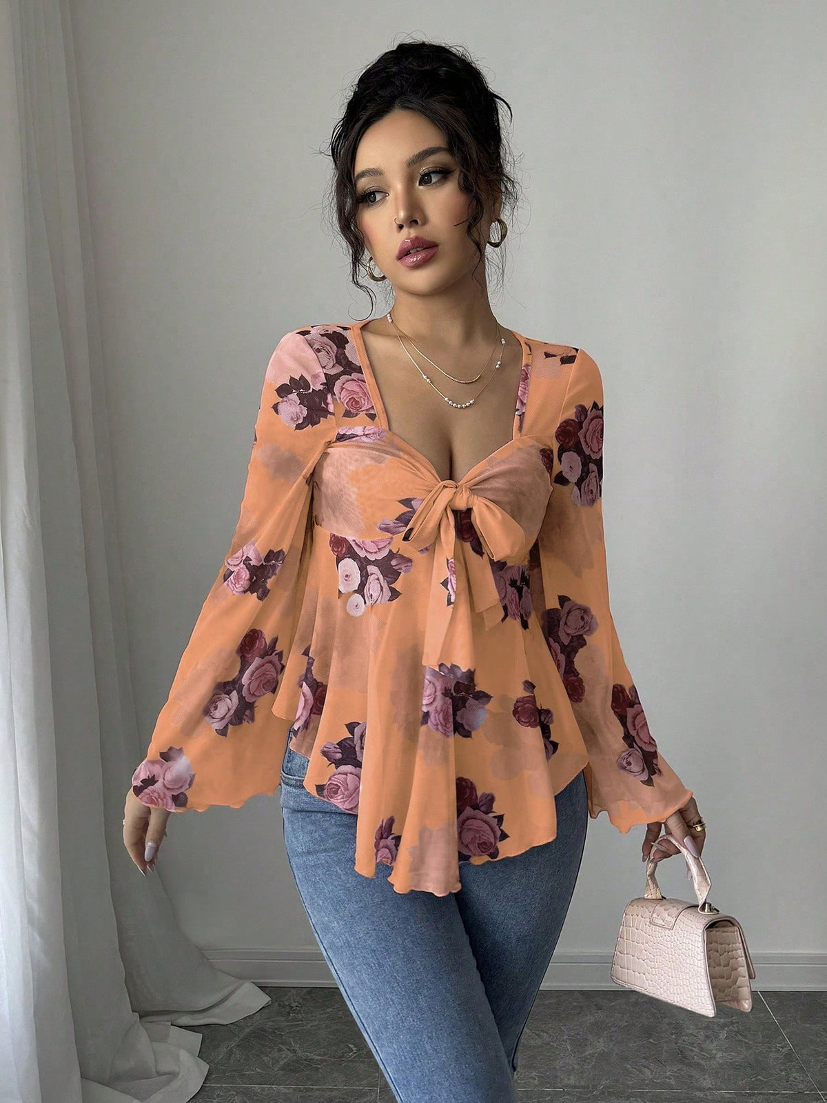 Orange floral bow-front blouse with long flared bell sleeves