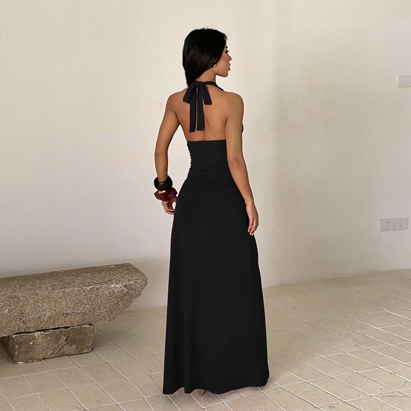Black halter-neck maxi dress with open back straps and long side slit