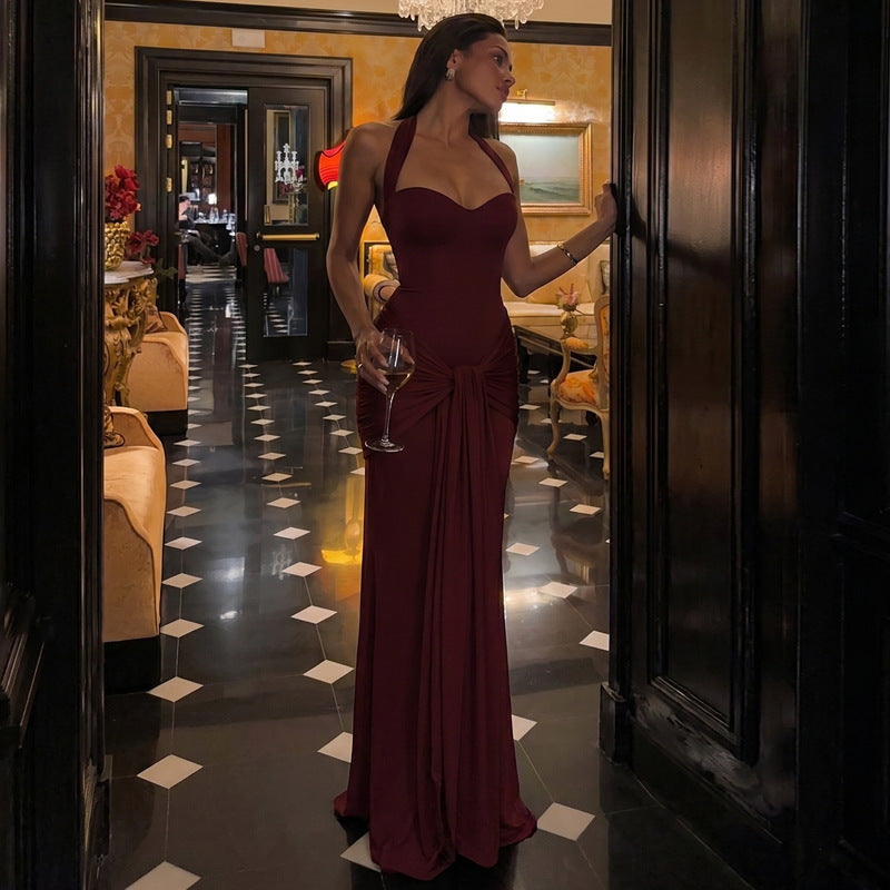 Burgundy halter neck maxi dress with draped front and gathered waist knot