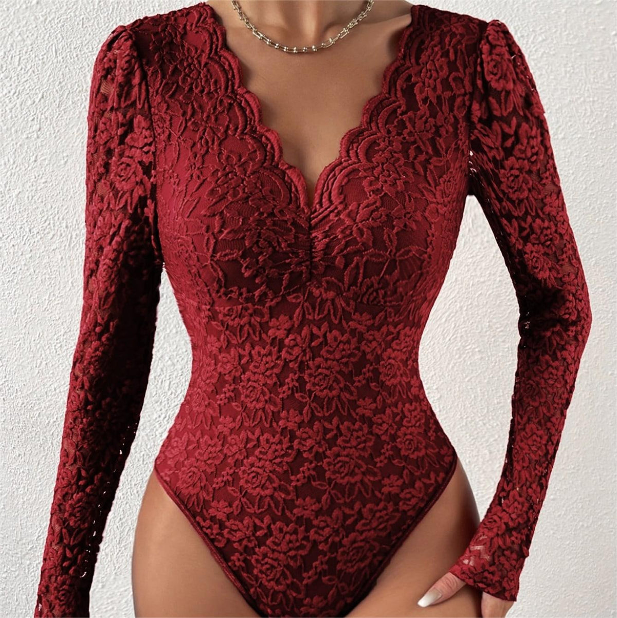Wine long-sleeve lace bodysuit with scalloped V-neck and fitted silhouette