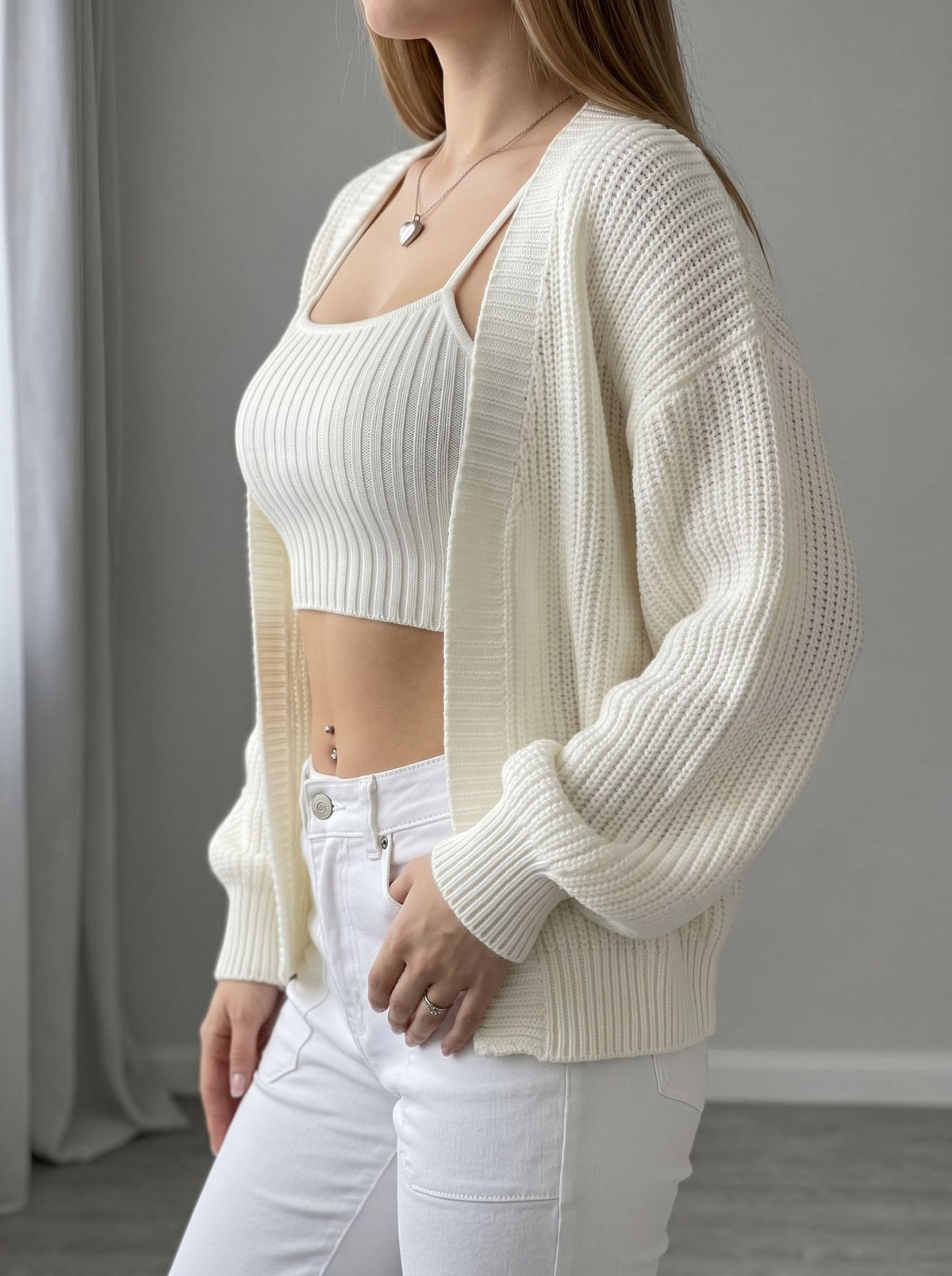 Ivory open-front knit cardigan, close-up balloon sleeves