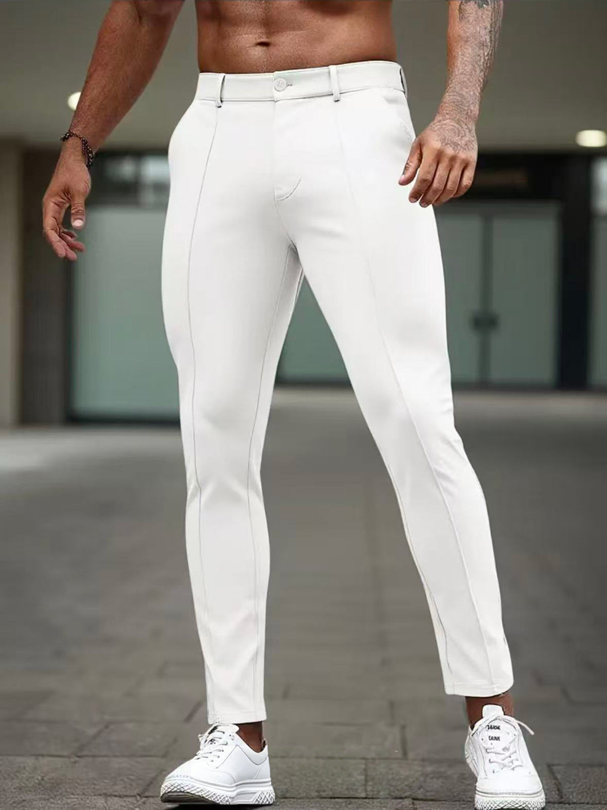 Men's slim-fit white dress pants with front seams and ankle-length tapered leg