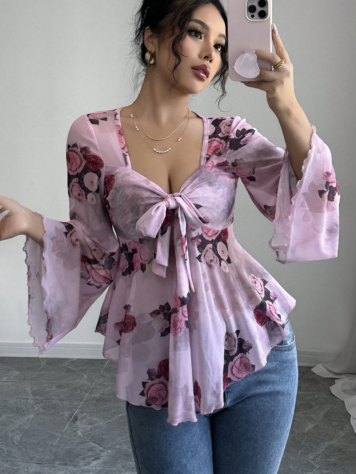 Light purple floral bow-front blouse with bow tie neckline and bell sleeves