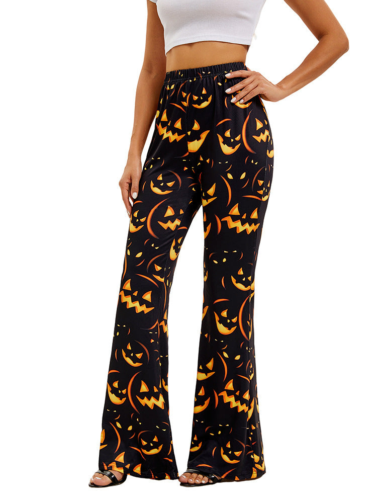 Women’s long bell-bottom trousers, black with orange jack-o’-lantern allover print