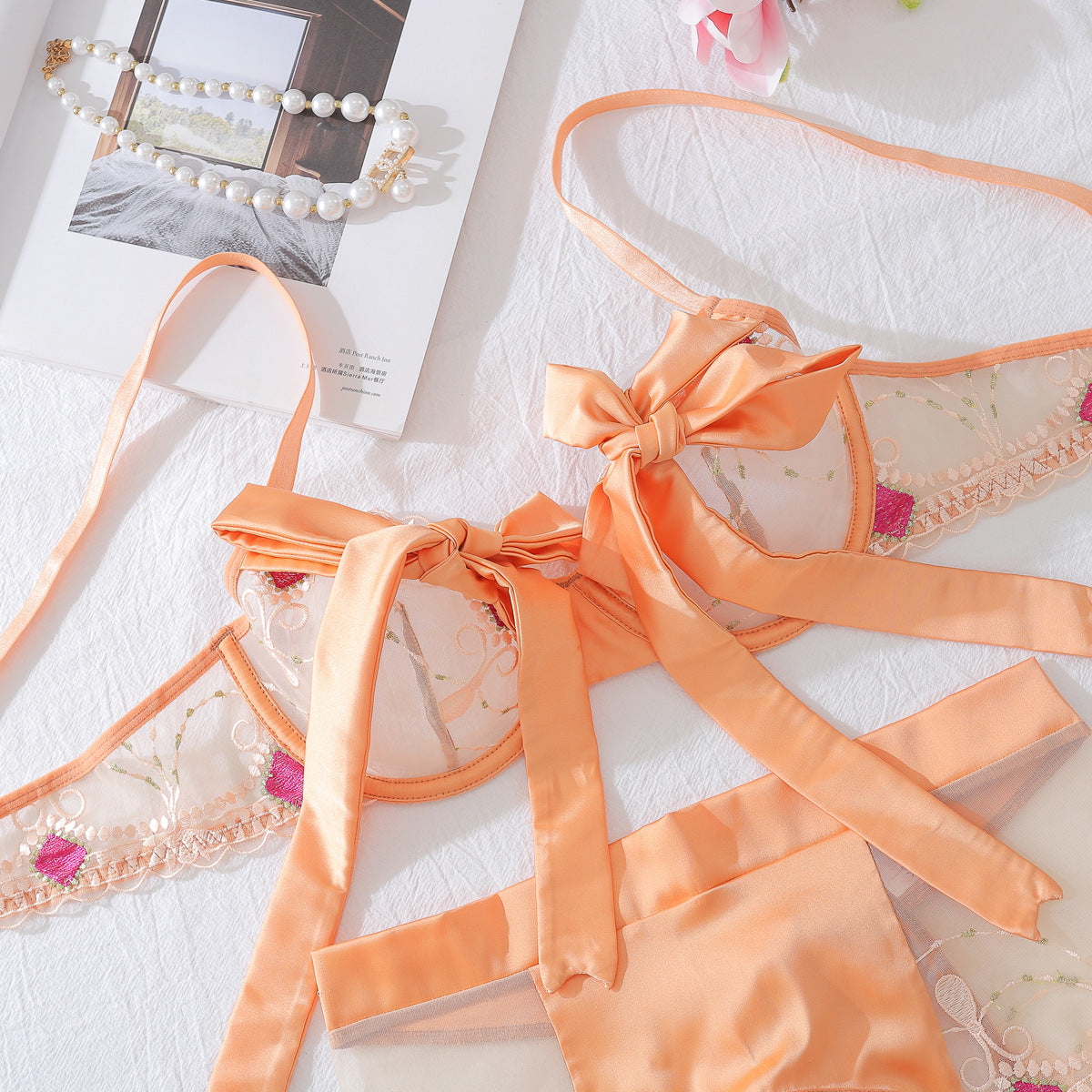 Embroidered mesh lingerie set in champagne with bow-tied bra straps and sheer lace trim panels