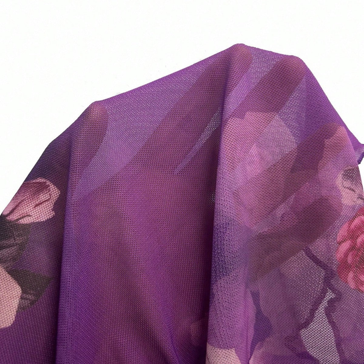 Light purple floral blouse fabric close-up with layered ruffle texture