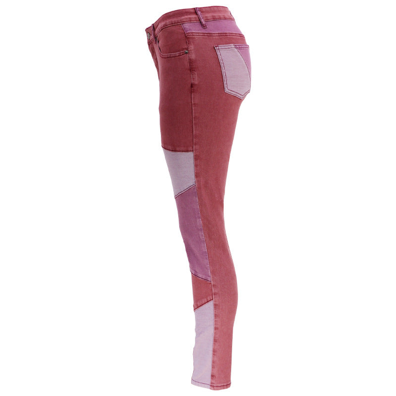 High-waist patchwork slim jeans in berry red with light lavender panels on the side legs.