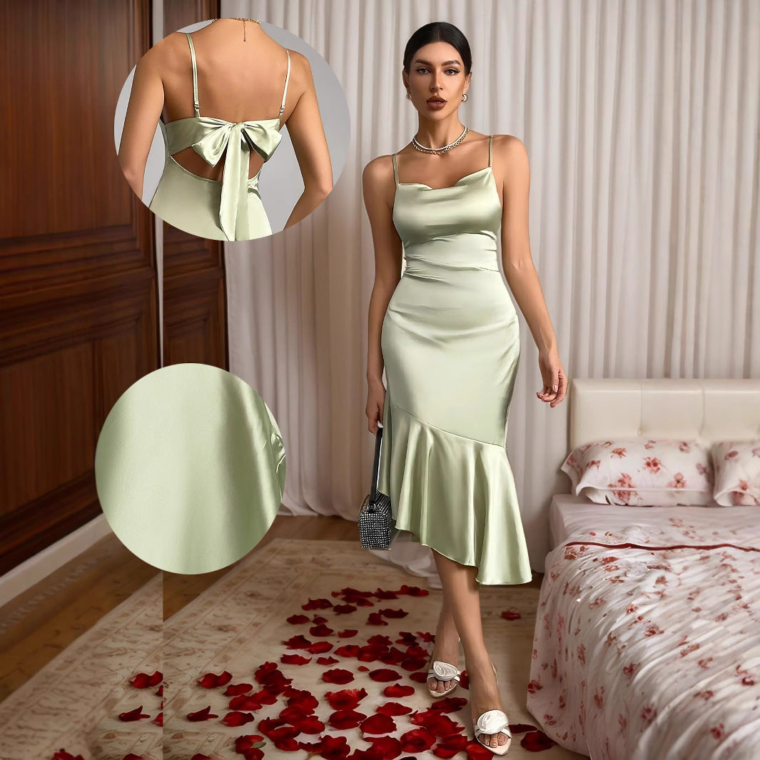 Light green satin midi dress with spaghetti straps and back bow, fitted mermaid hem