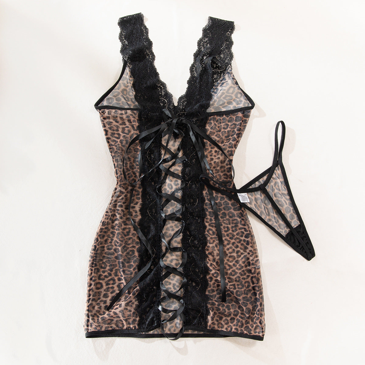 Leopard print mesh chemise with black lace back and crisscross tie bow