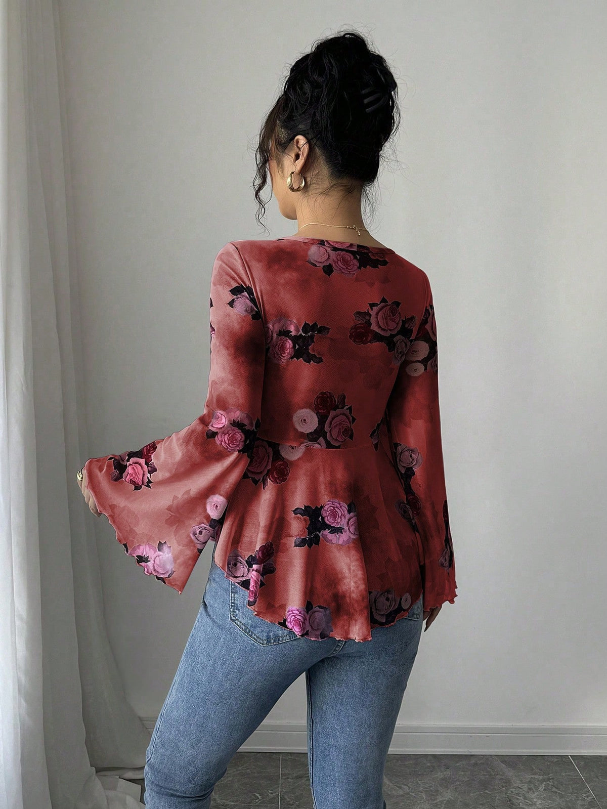 Burgundy floral bow-front blouse with long flared bell sleeves, back view