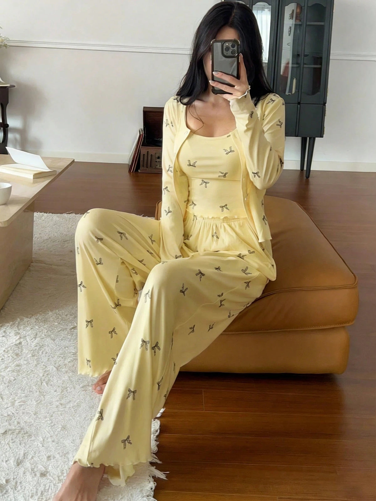 Three-piece bow-print pajama set in yellow: cami, long sleeves top, and matching pants