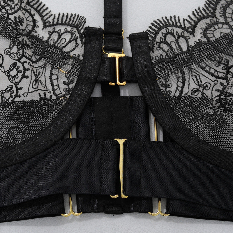 Black lace garter set with cross straps and gold-tone center hardware