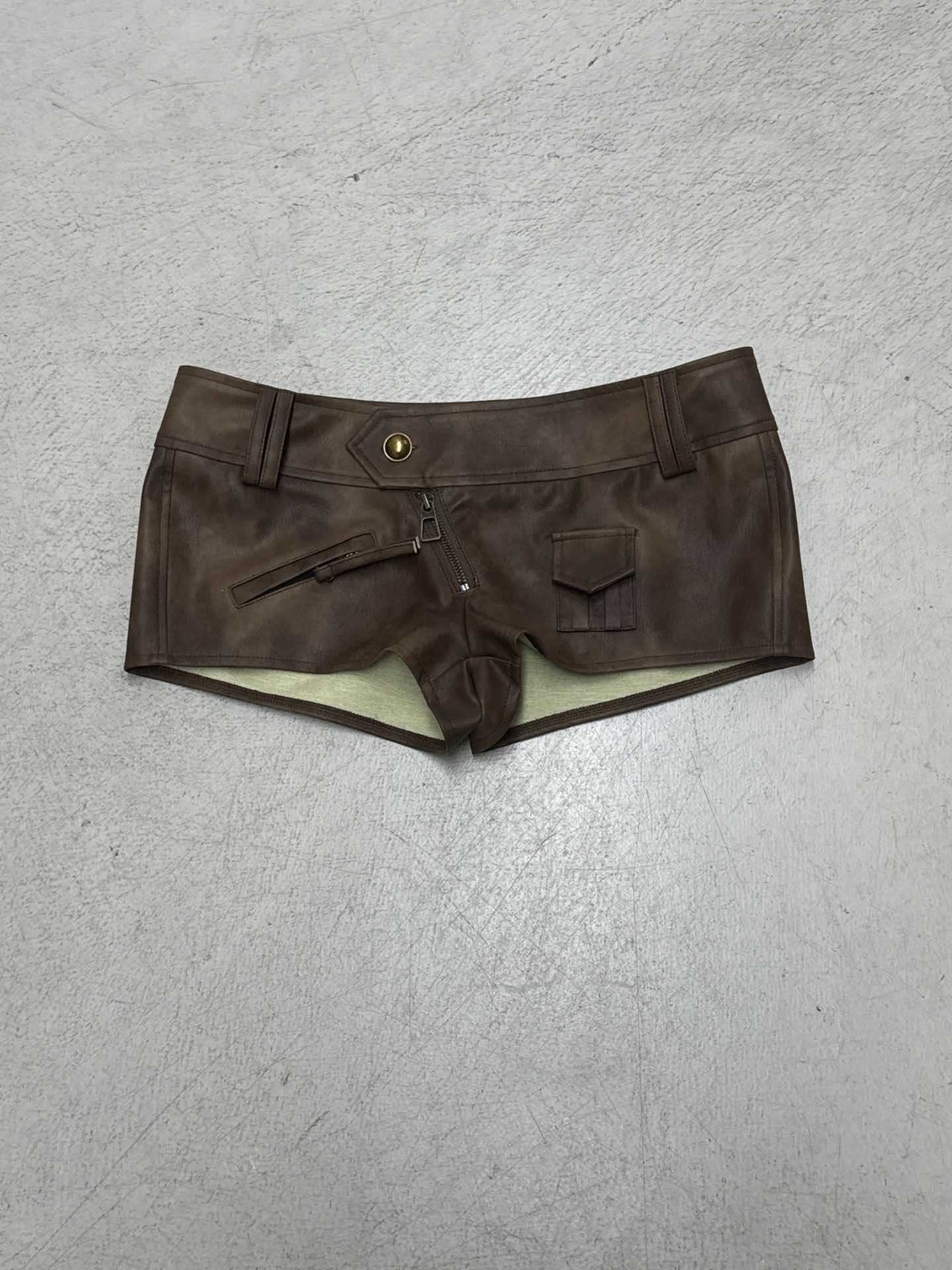 Brown leather-look low-rise shorts with zip front, patch pockets, belt loops.