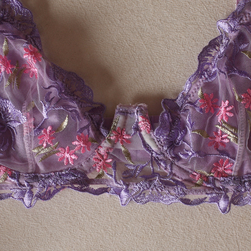 Lilac lingerie bottom with floral embroidery, lace trim, and scalloped elastic edges