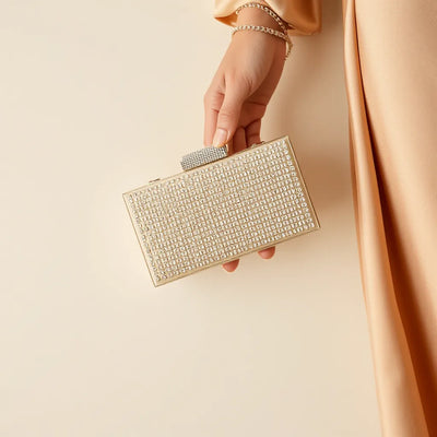 Sparkling rhinestone party clutch with a chain strap styled for a night-out look