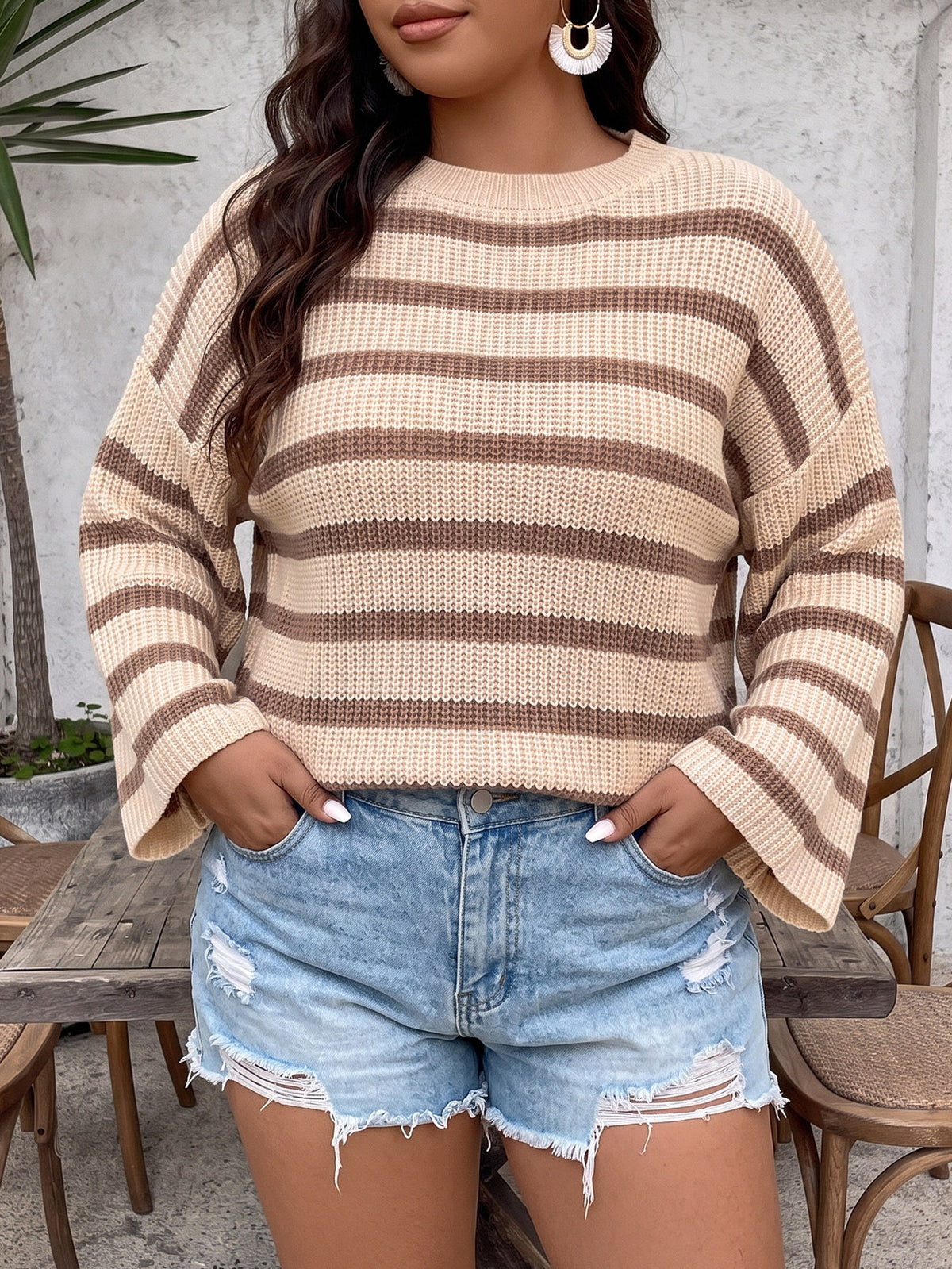 Beige striped knit pullover sweater with wide bell sleeves and ribbed crew neckline
