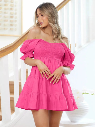Hot pink smocked tiered mini dress with puff sleeves and flounce cuffs