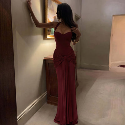 Wine red halter neck maxi dress with draped front and tied waist detail