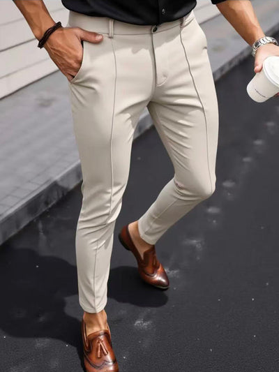 Men's slim-fit cropped dress pants in light beige with front crease seams