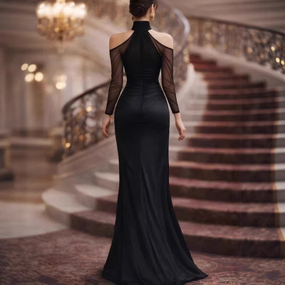 Black evening gown, back view, sheer long sleeves and high neck with ruched waist