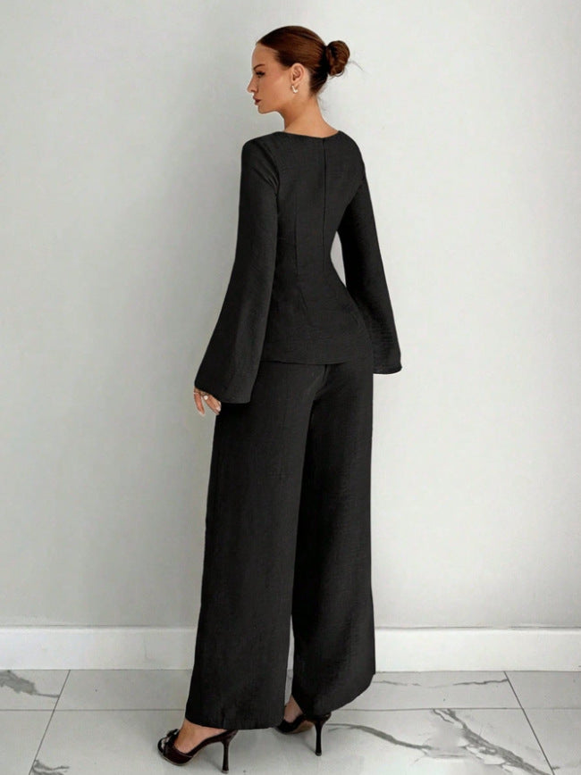 Black wide-leg pants set with shaped top and flared sleeves, full-length wide pants