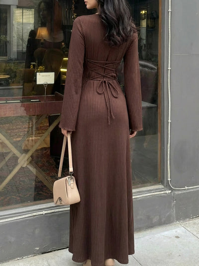 Brown long-sleeve ribbed maxi dress with lace-up back tie, fitted waist and full length