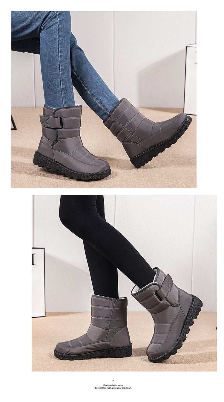Dark gray winter ankle boots with plush lining and buckle strap, side view.
