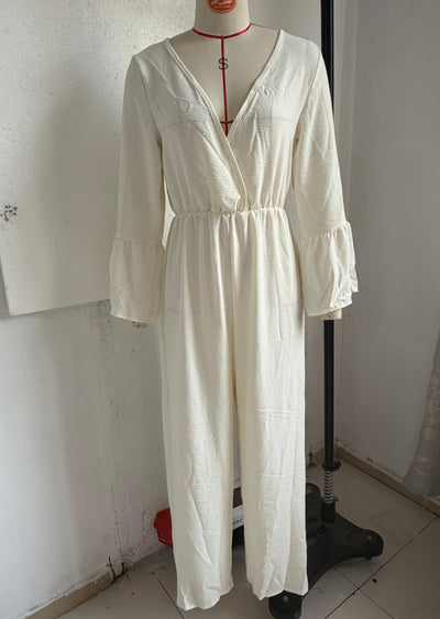 V-neck wide-leg jumpsuit in milky white with gathered waist and flared sleeves