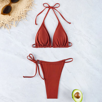 Triangle halter bikini set with rust red top and matching rust red string bottoms