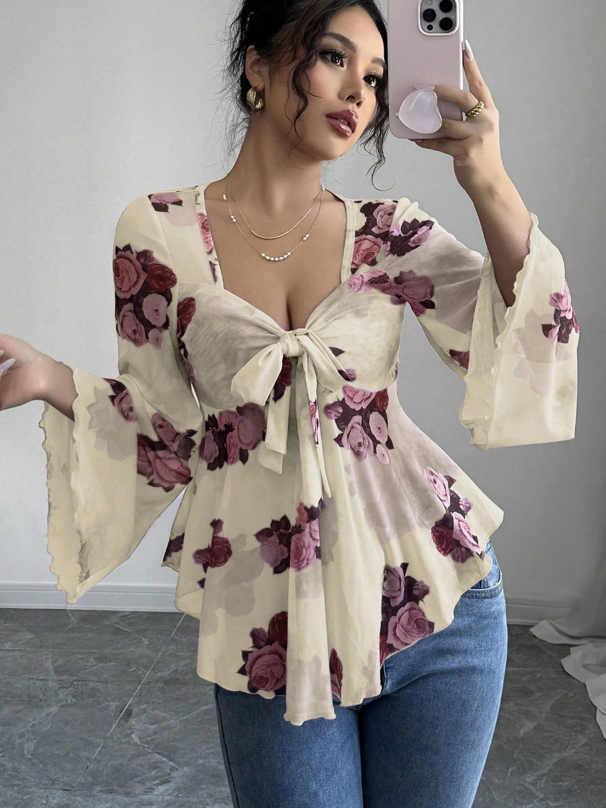 Cream floral bow-front blouse with long flared bell sleeves