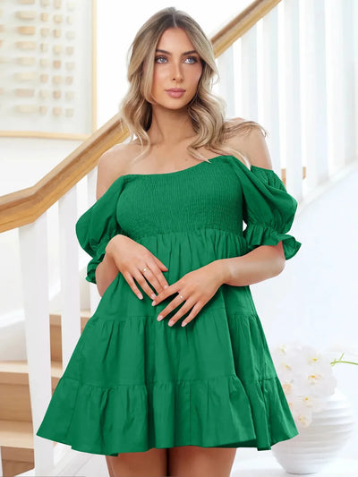 Dark green smocked mini dress with off-shoulder neckline and puff sleeve cuffs