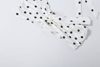 White polka-dot off-shoulder top with ruched center and waist bow detail