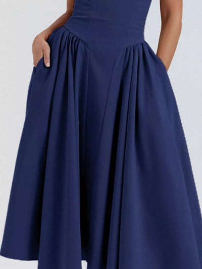 Navy blue dress with a plain background