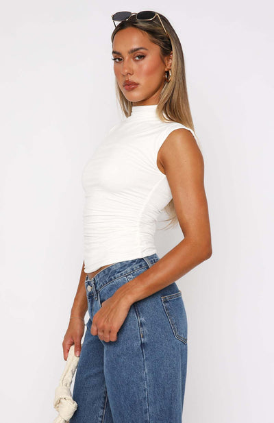 Ruched mock neck sleeveless tank top, white fitted design, side view