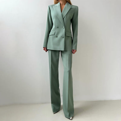 Three-piece suit set in muted green: tailored blazer over button-front vest with wide-leg pants