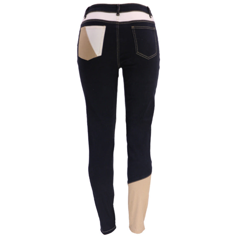 High-waist patchwork slim jeans in black with cream and tan geometric panels on the back legs.