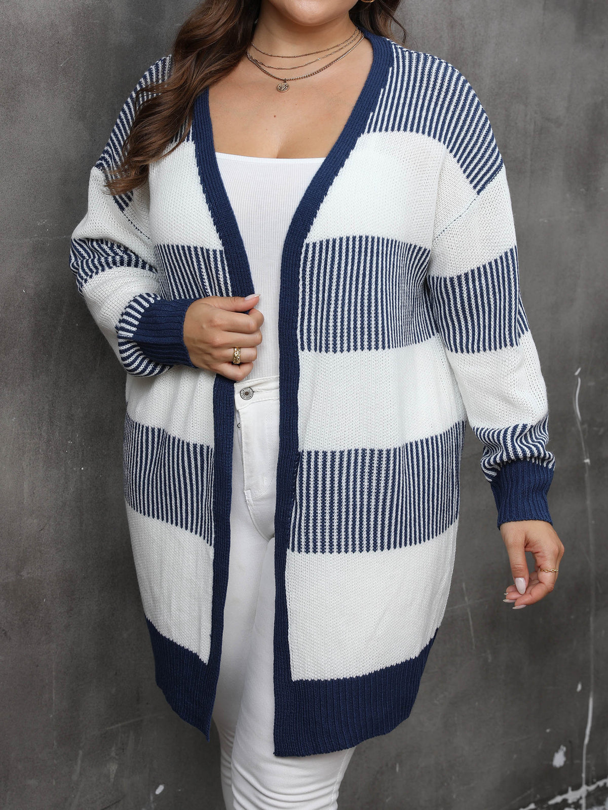 Plus-size striped knit cardigan sweater coat, front view, white and navy blue blocks
