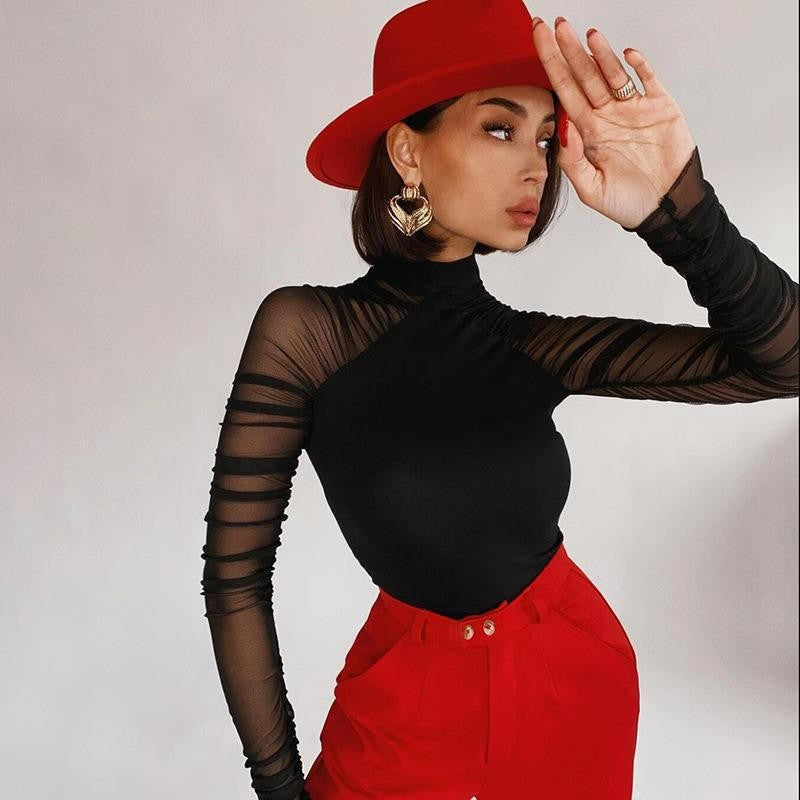 Black mock neck bodysuit with sheer mesh sleeves and fitted high neckline