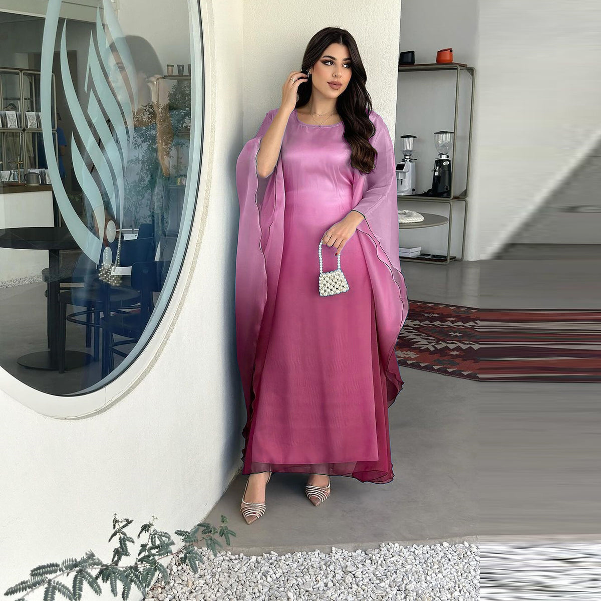 Ombre satin maxi dress with sheer draped batwing sleeves and scoop neckline in purple.