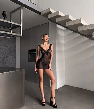 Black lace-trim mesh chemise with scalloped V neckline and sheer mini cut