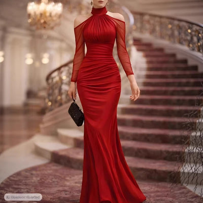 Red sheer long-sleeve evening gown with high neck, ruched bodice and floor-length mermaid