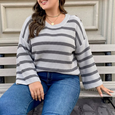 Gray striped knit pullover sweater with wide bell sleeves and crew neckline