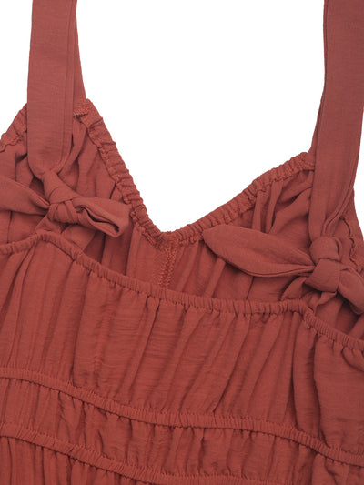 Rust-red smocked V-neckline with gathered ruffle at waist
