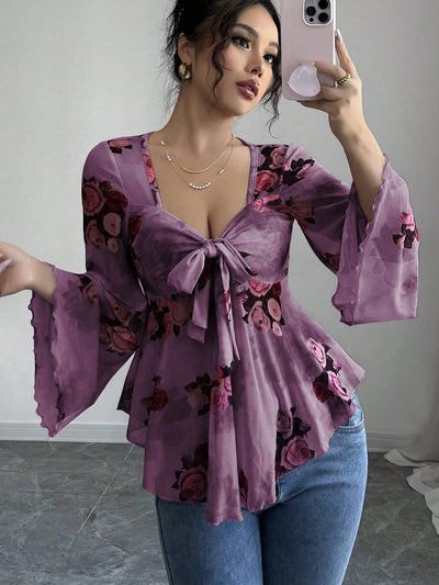 Light purple floral bow-front blouse with long flared bell sleeves